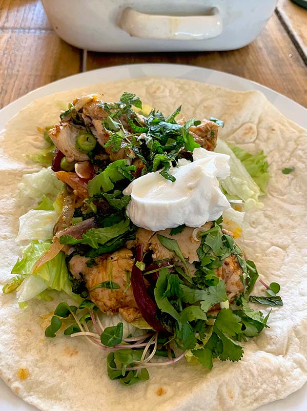 Chicken shawarma served in a pitta wrap