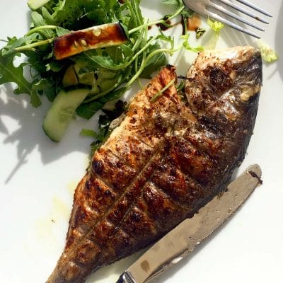 Whole masala fish with tomato salad