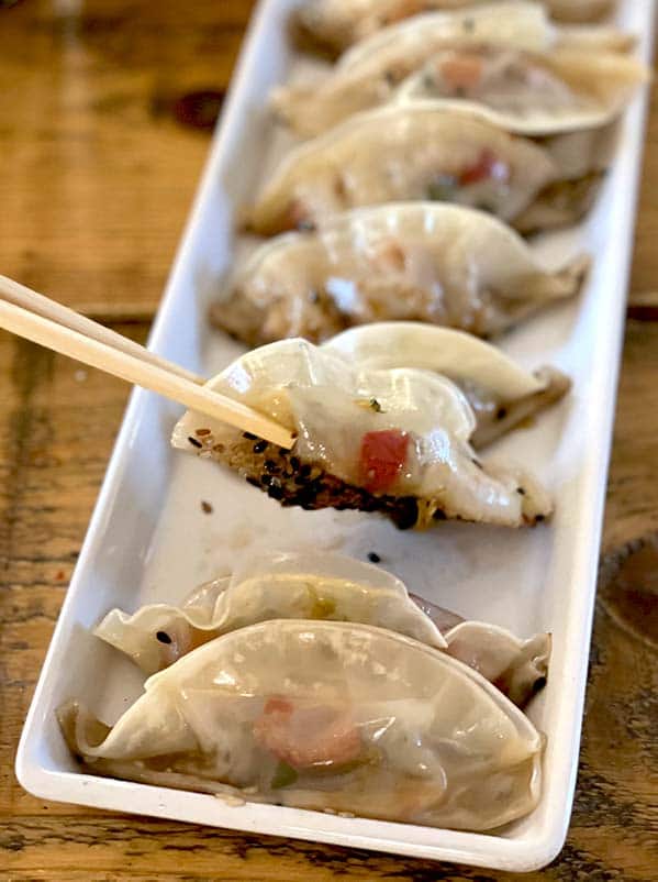 Pot stickers eaten with chopsticks