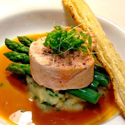 Salmon medallions with a prawn bisque serving