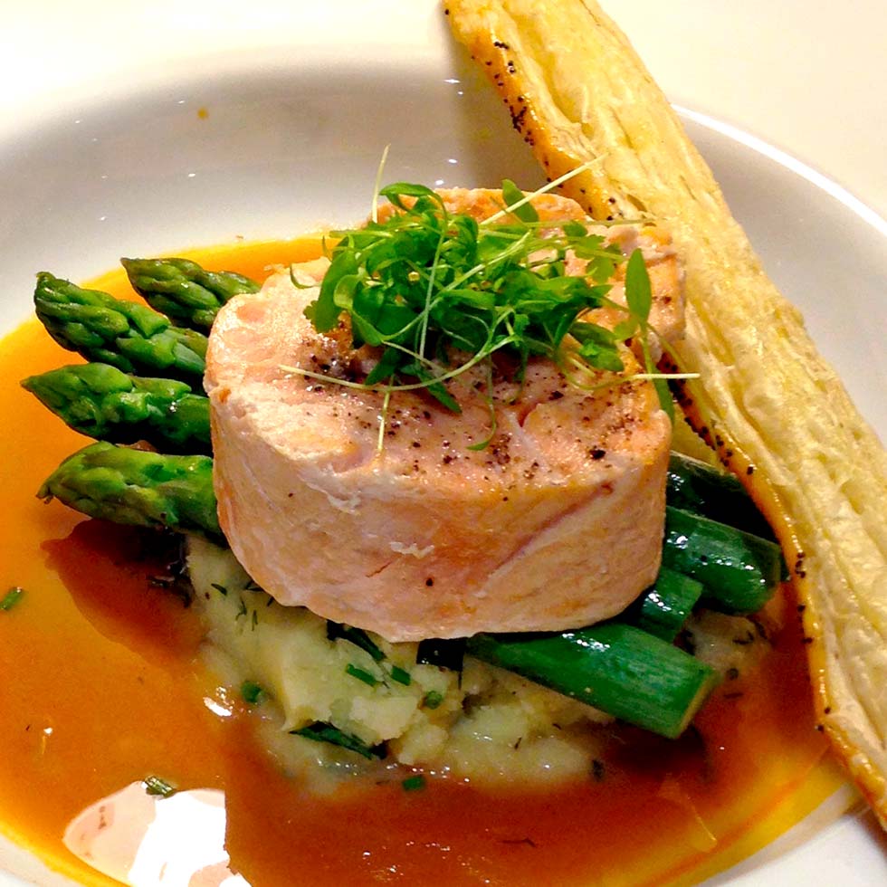Salmon medallions with a prawn bisque serving