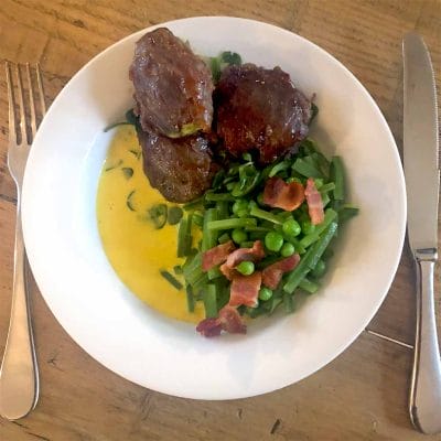 Confit pork cheek with celeriac mash and saffron sauce