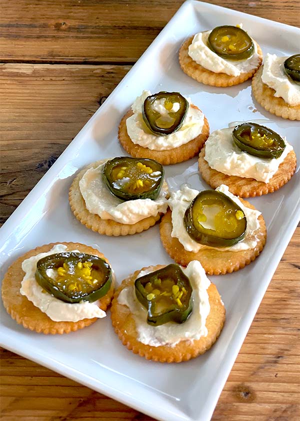 Cowboy candy - jalapenos on cream cheese on crouton