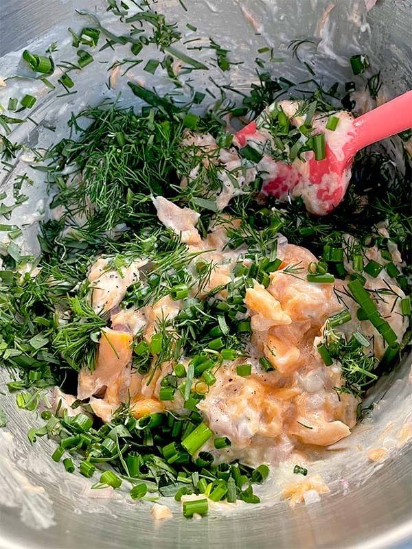 Salmon rillettes adding herb mixture