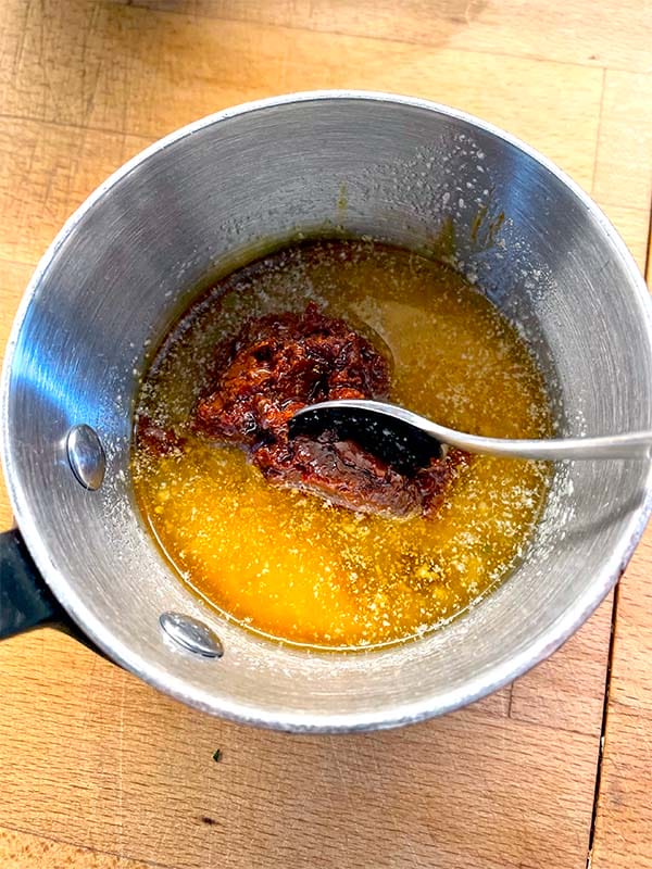 Adding harissa to melted butter