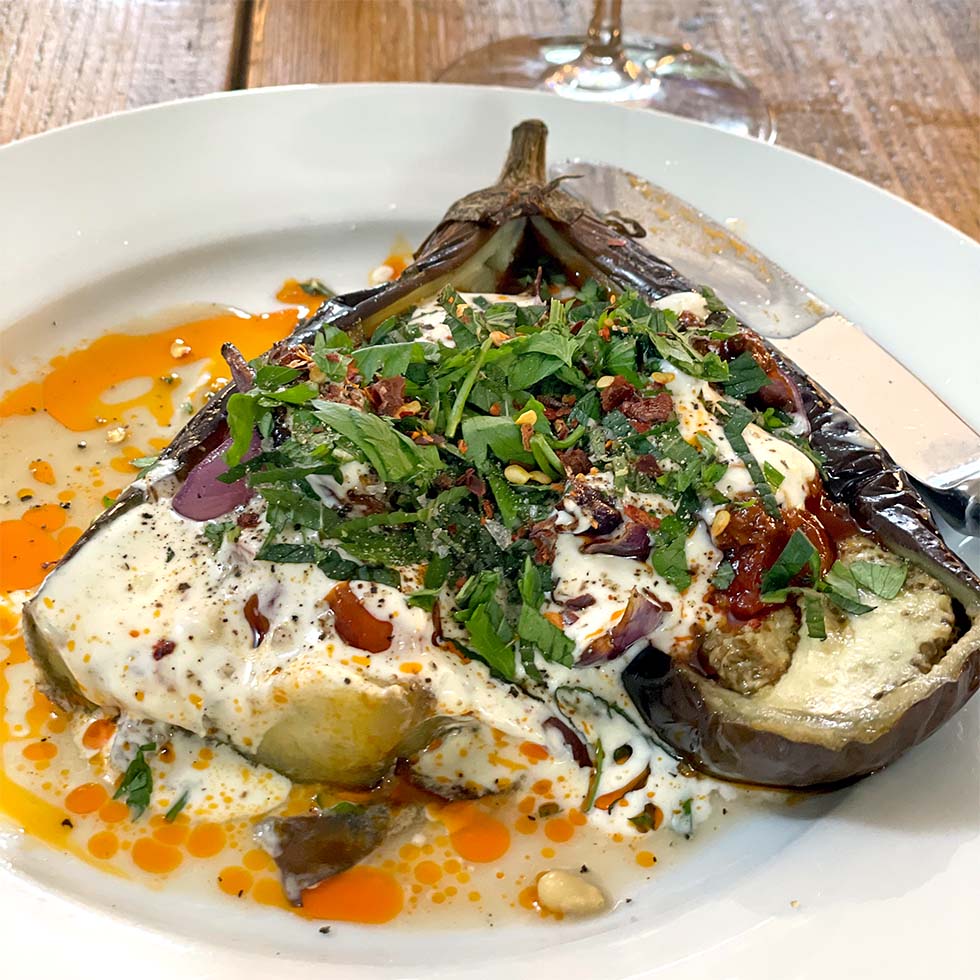 Roast aubergine stuffed with tomato and onion
