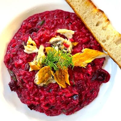 Beetroot risotto served with smoked mackerel