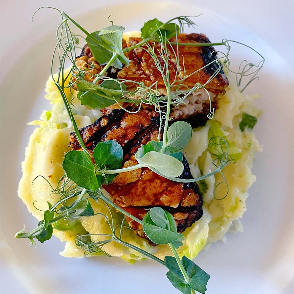 Roast pork belly with crackling, sublime mash & cider sauce