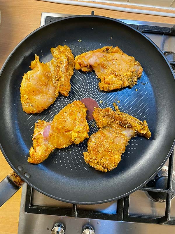 Fry the chicken coated in marinade