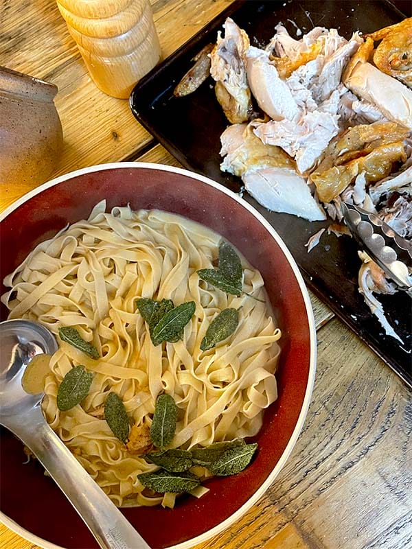 Roast chicken with sage and lemon pasta served