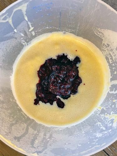 Mix berrys into the custard