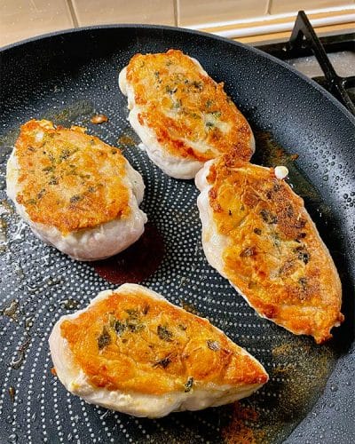 Golden brown crispy skin cooked chicken breasts
