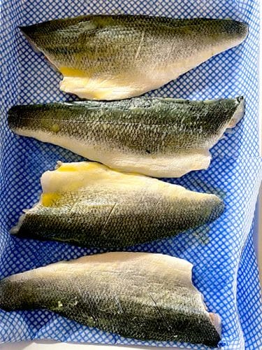 Sea bass fillets brushed with olive oil