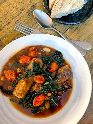 Sausage bean and tomato stew served