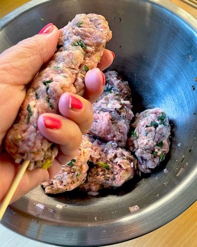 Thread the minced lamb on to a wooden skewer